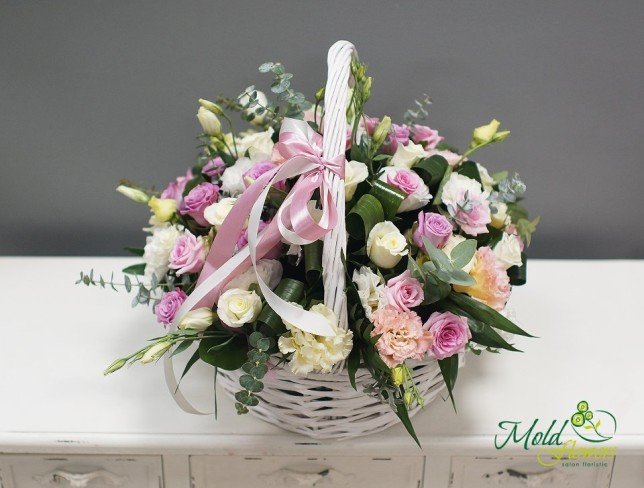Basket with white, pink and purple roses photo