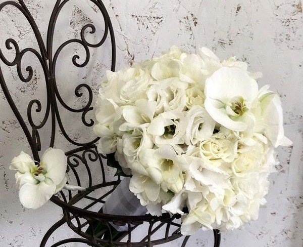 Bridal Bouquet with White Freesia, Eustoma, Roses, Hydrangea, and Orchid + Boutonniere for the Groom photo