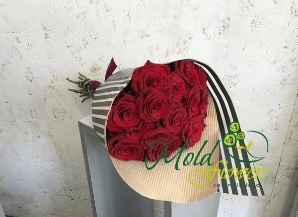 Bouquet of red roses in striped paper photo