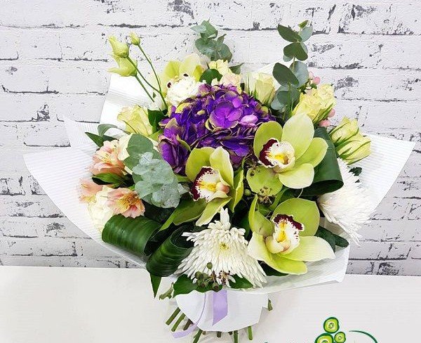 Bouquet of green orchids, purple hydrangeas, white and green roses, white chrysanthemums, pink alstroemerias, hypericum, eucalyptus photo