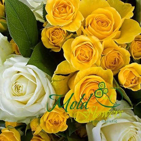 Bouquet of white, yellow roses and yellow bush roses in kraft paper photo