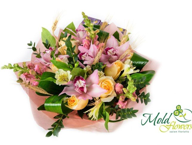 Bouquet of yellow roses, pink orchids, white alstroemeria, salal, eucalyptus, aspidistra, lion's zeo photo