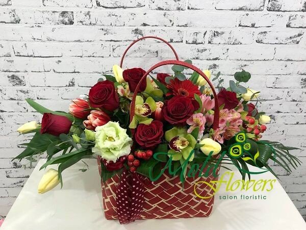 Red purse with red roses, tulips, hypericum, white tulips, green orchids, pink alstromeria photo