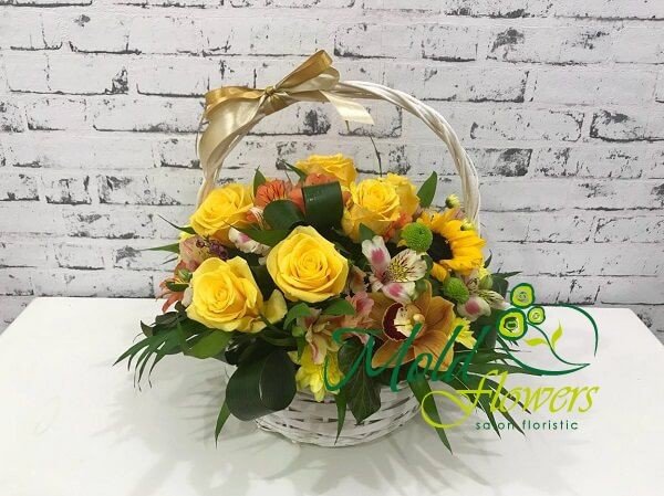 Basket with yellow roses, sunflowers, chrysanthemums, orange and pink alstromeria, green chrysanthemums photo