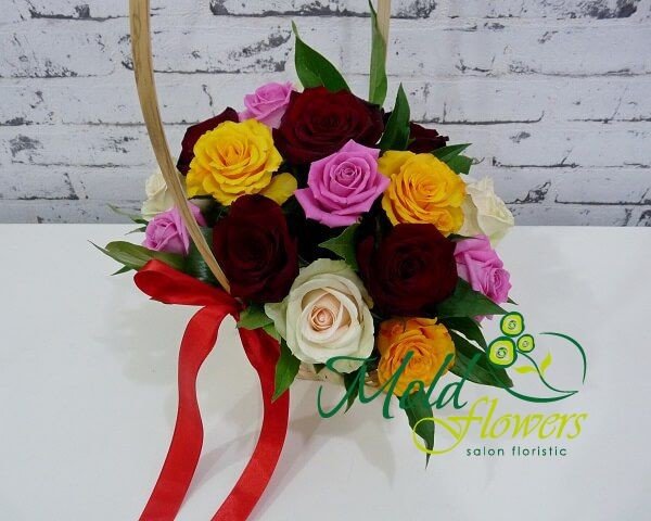 Basket with red, yellow, pink, white roses with red ribbon photo