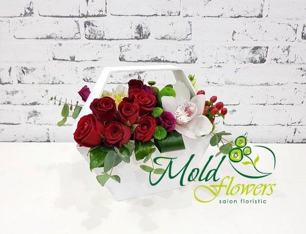 White box with red and pink roses, white orchid, green chrysanthemums, yellow alstromeria, hypericum photo