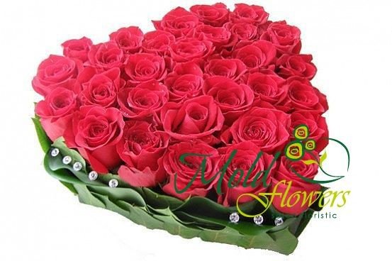 Beautiful composition - a heart of red roses with diamonds photo