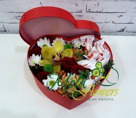 Red heart box with red roses, yellow orchid, orange alstromeria, white and green chrysanthemums and candies photo