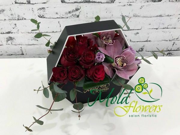 Black box with red and purple roses, pink orchid and eucalyptus photo