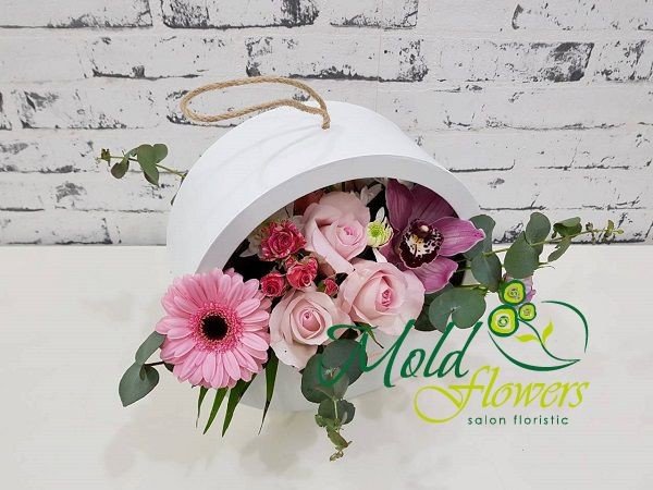White round box with pink roses, gerbera, orchid, small flowered rose, white chrysanthemum and eucalyptus photo