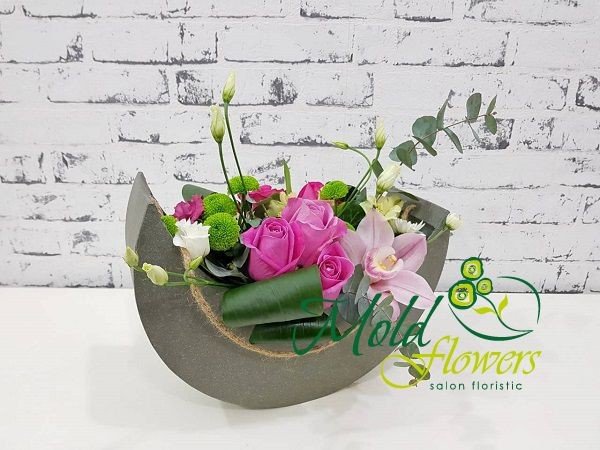 Composition of pink roses, orchids, white eustomas, green chrysanthemums, aspidistra and eucalyptus photo