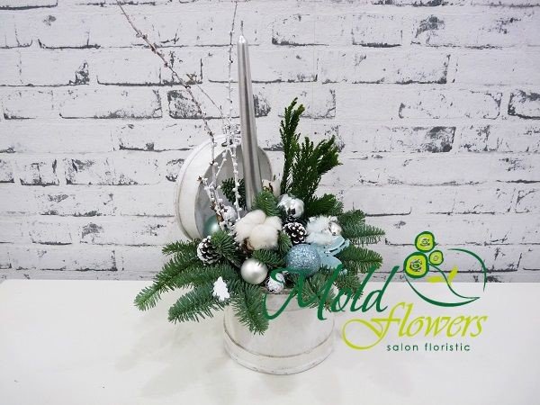 White jewelry box with Christmas tree toys, sprigs of spruce, cottonwood blossoms, pinecones, and a silver colored candle photo
