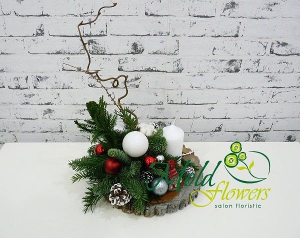 Composition with sprigs of spruce, white candle, cones and Christmas toys photo