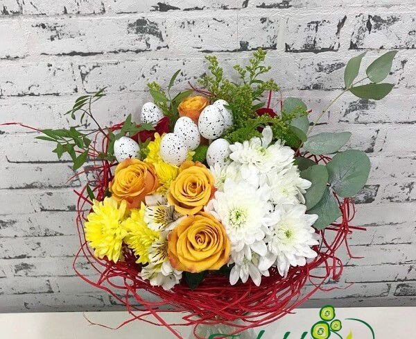 Red framed bouquet with yellow roses, chrysanthemum, white alstromeria, chrysanthemum and decorative eggs photo