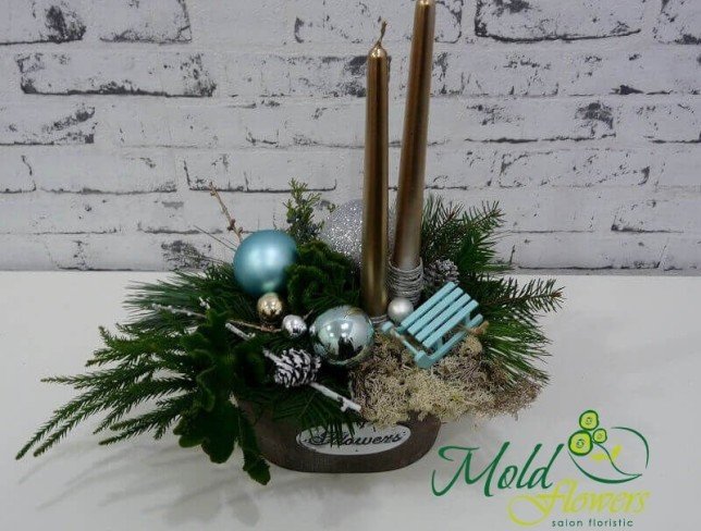 Composition with golden candles, cones, blue sleigh, Christmas toys, spruce branches photo