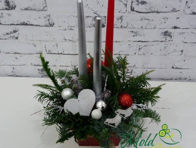 Composition with sprigs of spruce, red and silver candles, Christmas toys, cones photo