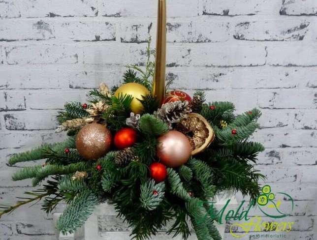 Composition with golden candle, cones, Christmas toys, fir branches photo