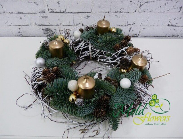 Wreath with sprigs of spruce, golden candles, cones, Christmas toys photo