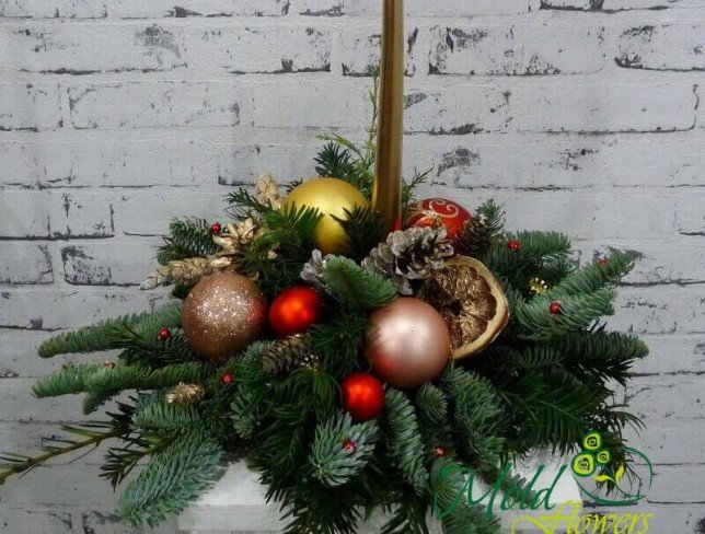 Composition with golden candle, cones, Christmas toys, fir branches photo