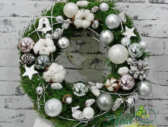 Wreath of spruce branches, with cotton, cones, decorative stars, Christmas toys photo