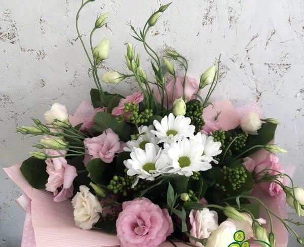 Bouquet of pink and cream eustomas, white chrysanthemum in a pink wrapper photo