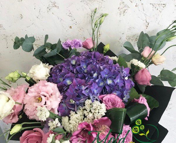Bouquet with purple hydrangea, pink rose, eustoma, alstroemeria, white statice, eustoma, eucalyptus photo