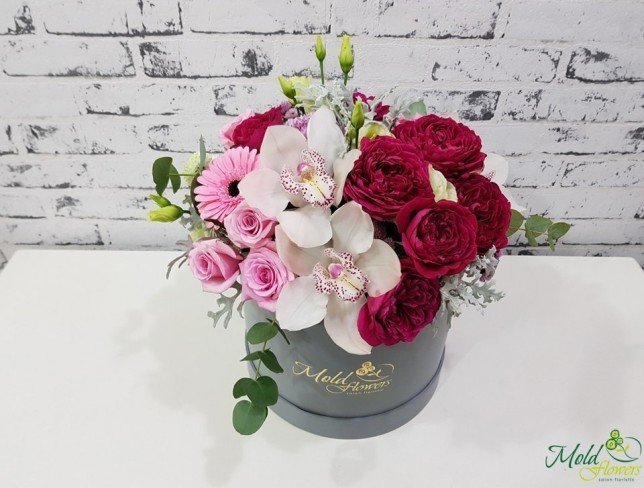 Box with pink roses, peony roses, gerberas, chrysanthemums, white orchids, eustomas photo