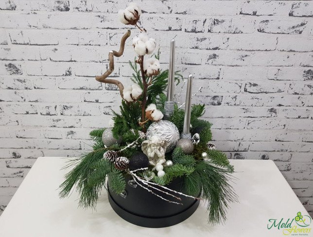 Black box with silver candles, pinecones, cotton, Christmas toys, spruce branches, angel photo