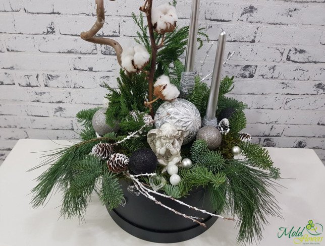 Black box with silver candles, pinecones, cotton, Christmas toys, spruce branches, angel photo