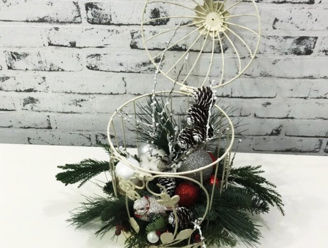 Composition with spruce branches, cones, cotton, Christmas toys, white candle, decorative bird photo