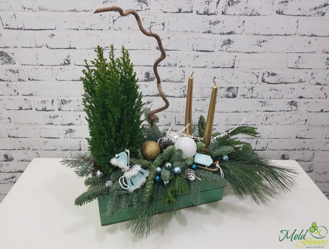 Composition with thuja, golden candles, cones, Christmas toys, sprigs of spruce, decorative sleigh photo