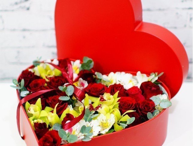 Red Heart-Shaped Box with Red Roses and Green Orchids photo