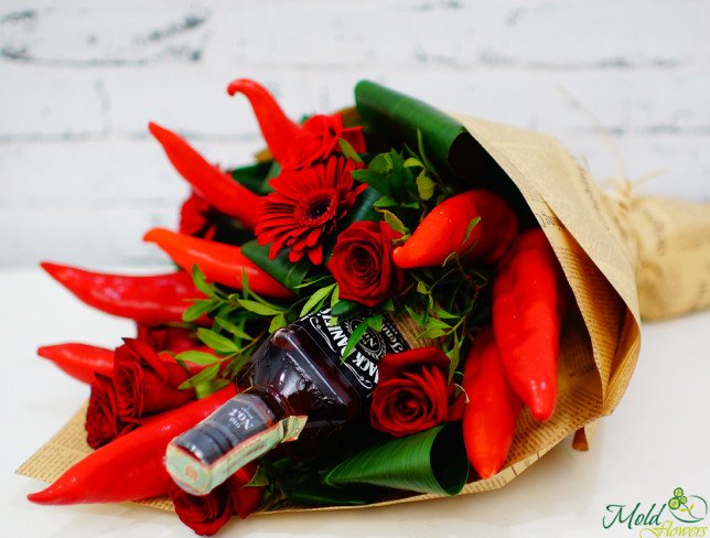 Bouquet with red roses, gerberas, bottle of Jack Daniel's, red pepper in kraft paper photo