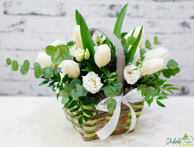 Basket with white roses, tulips, eustoma, eucalyptus photo