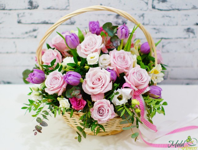 Basket of pale pink roses, alstromeria, eustomas, purple tulips, white eustomas, pistachio, eucalyptus photo