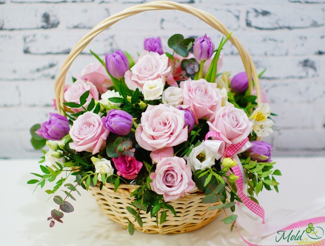 Basket of pale pink roses, alstromeria, eustomas, purple tulips, white eustomas, pistachio, eucalyptus photo