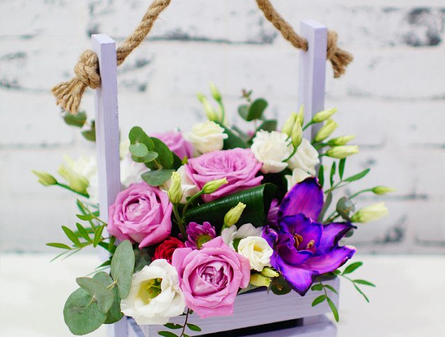 Box of lilac roses, cymbidium orchids, chrysanthemums, white eustoma, chrysanthemums, eucalyptus, aspidistra photo