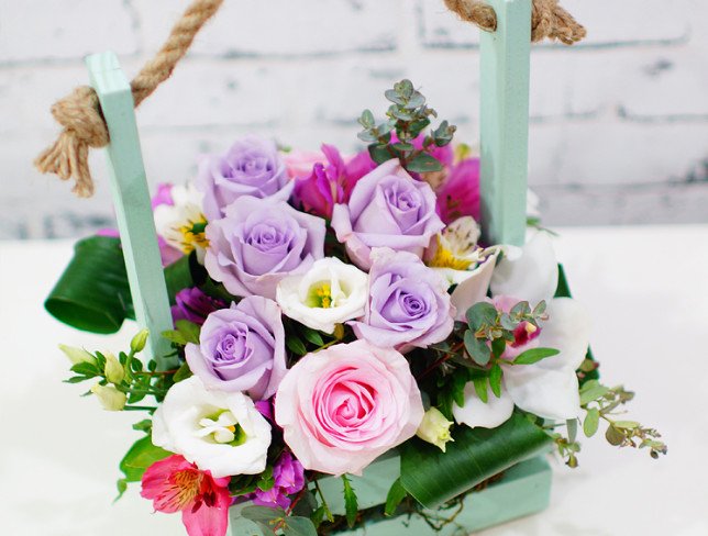Box of lilac and pink roses, white eustoma, orchid, pink and purple alstroemeria, eucalyptus, aspidistra photo