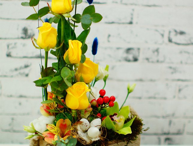Pasta arrangement with yellow roses and green orchids photo
