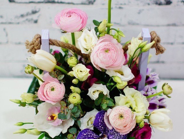 Box with white orchids, eustoma, tulips, pink ranunculus, eustoma, purple orchid, alstroemeria, eucalyptus photo