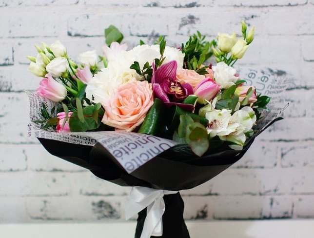 Bouquet of white hydrangea, alstroemeria, eustoma, pink roses, tulips, cymbidium orchids, eucalyptus photo