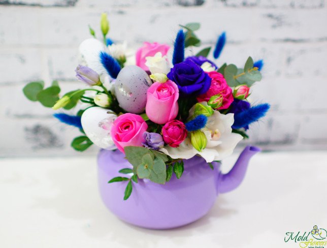 Teapot made of pink roses, bush roses, purple eustoma, spikes, white cymbidium orchid, eggs, eucalyptus photo