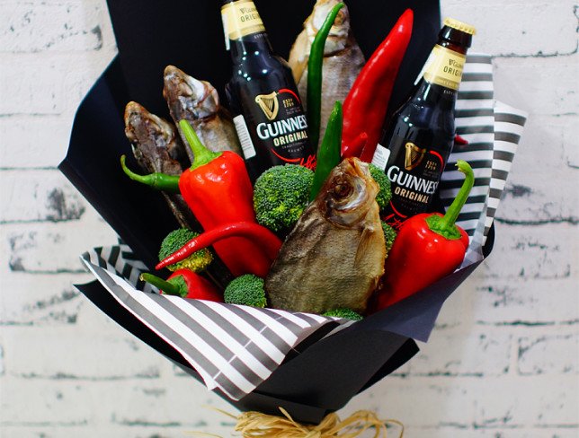 Men's bouquet made of red and green peppers, broccoli, dried fish, Guinness beer bottles photo