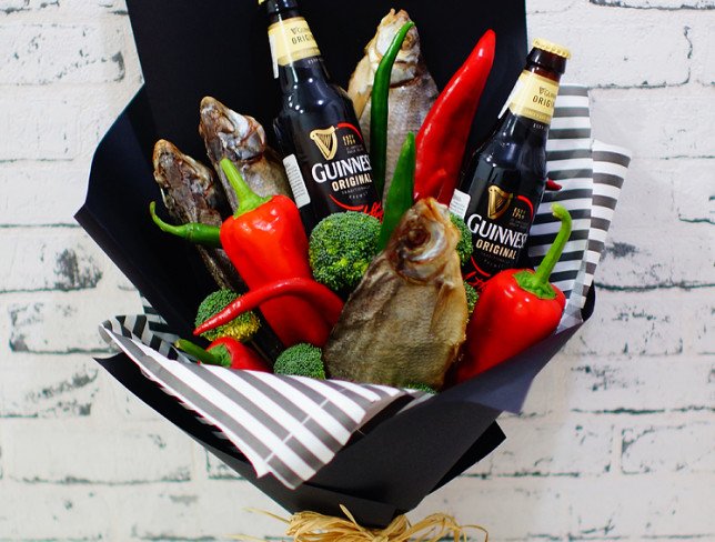 Men's bouquet made of red and green peppers, broccoli, dried fish, Guinness beer bottles photo