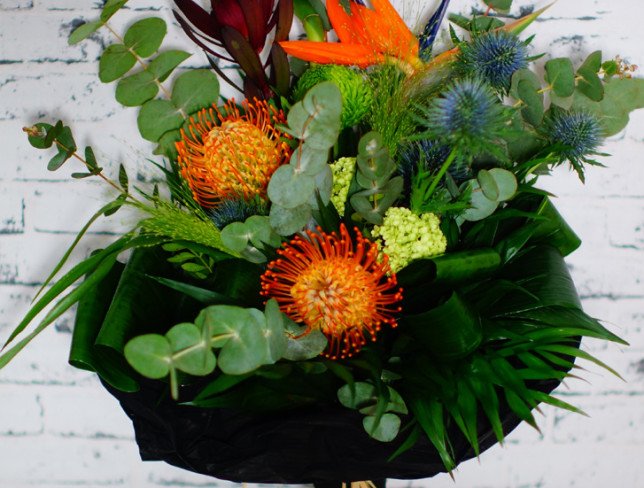 Bouquet with leucospermum, bamboo, strelitzia, chrysanthemum, leucadendron, eucalyptus photo