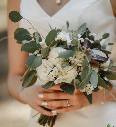 The bride's bouquet made of white rose, lisianthus, eucalyptus, and stone rose photo 394x433