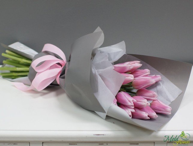 Bouquet of pink tulips in gray paper photo