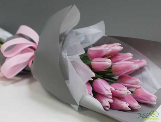 Bouquet of pink tulips in gray paper photo