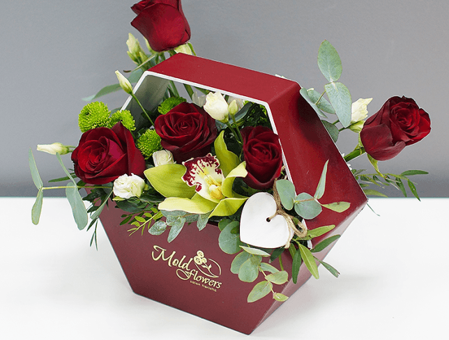 Composition with roses in burgundy box photo