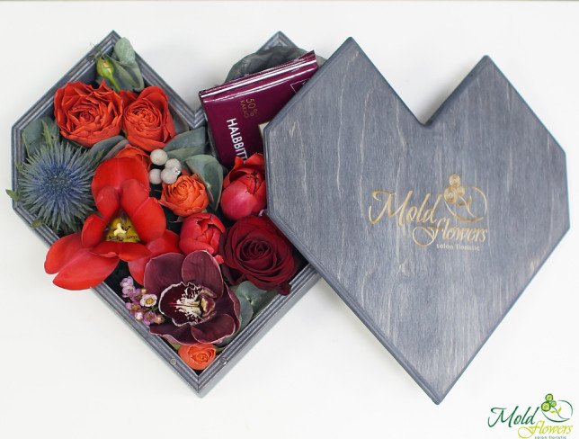 Wooden heart-shaped box with flowers photo